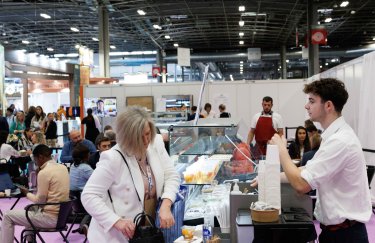 Customer buying something to eat inside the show hall